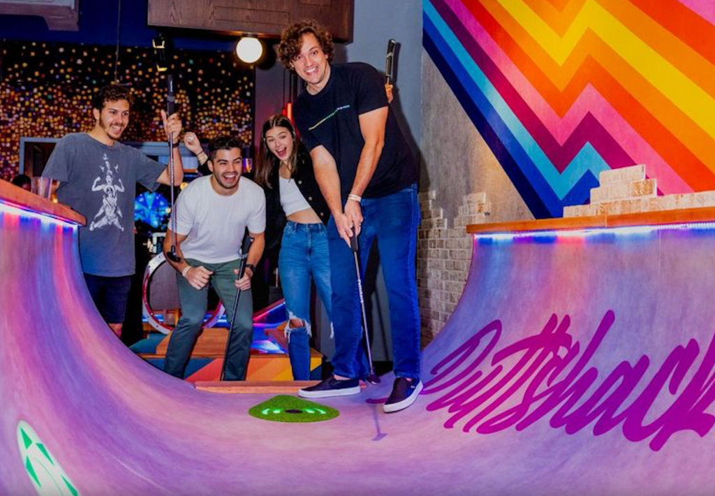 People playing mini golf in Puttshack.